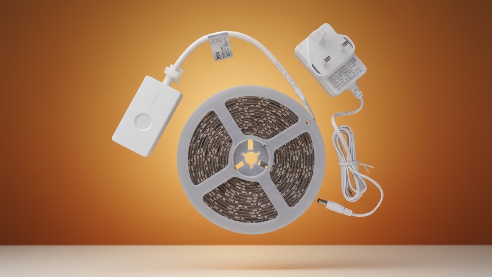 Innr FL 250 C box contents: LED strip reel, Zigbee control module, and UK power adapter